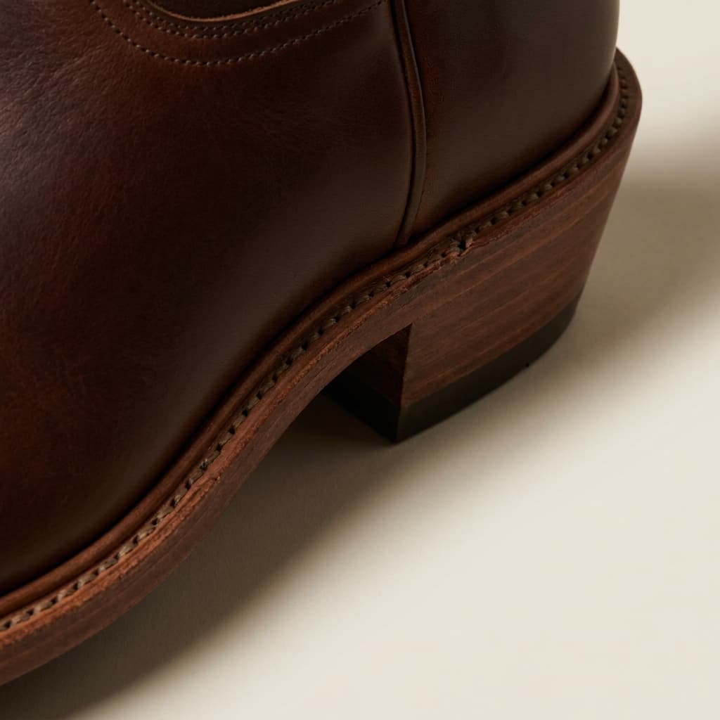 Hand-welt and sole-edge detail of The Arroyo: hand-welted leather sole with a steel shank, full-grain bovine in dark whiskey, vegetable-tanned