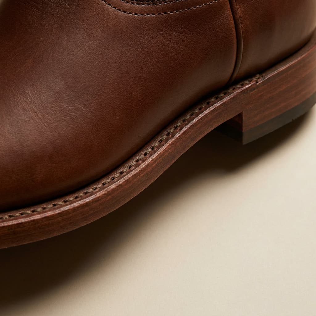 Hand-welt and sole-edge detail of The Mesa: hand-welted leather sole, single-row stitch, full-grain bovine, vegetable-tanned, six-week saddle finish