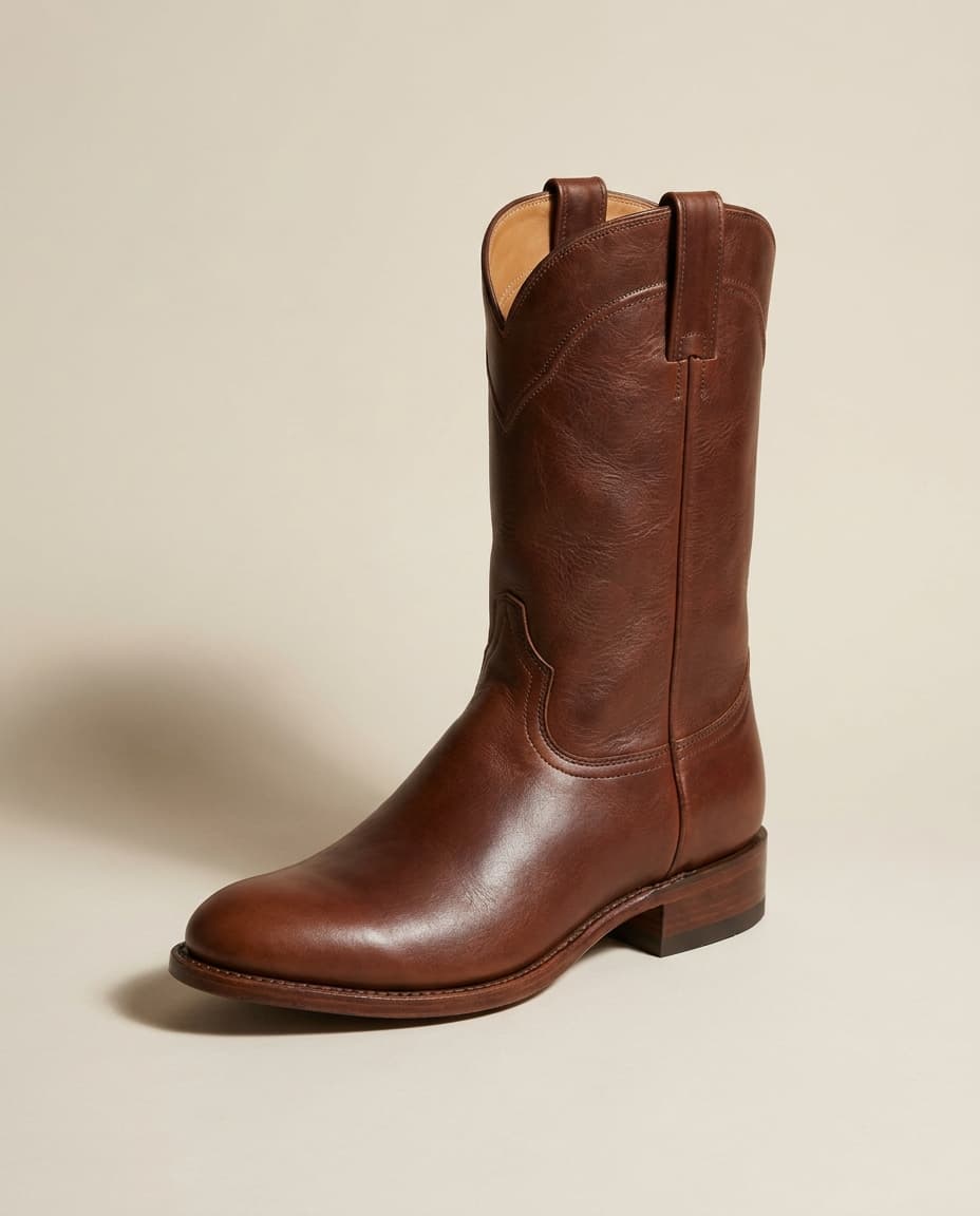 Editorial product photograph of The Mesa, a rounded-toe walnut full-grain leather western roper boot with a 1.5 inch walking heel and a leather sole
