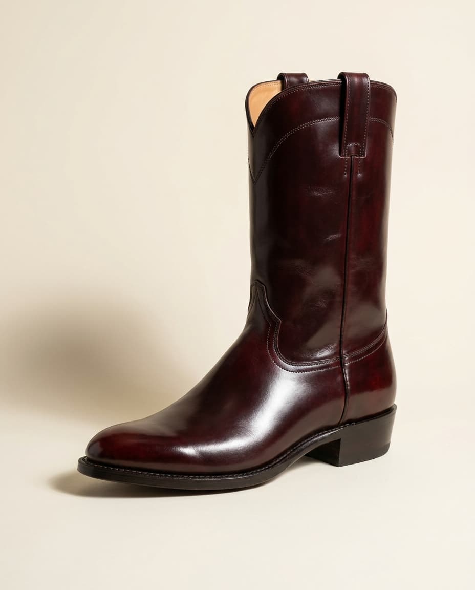 Editorial product photograph of The Ocotillo, a Horween shell cordovan colour-8 narrow round-toe western boot with hand-welted leather sole