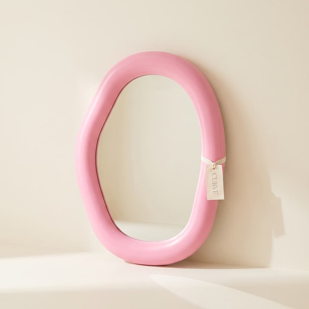 Curve Bubble Mirror, an oversized mirror with a chunky rounded organic frame in candy pink.