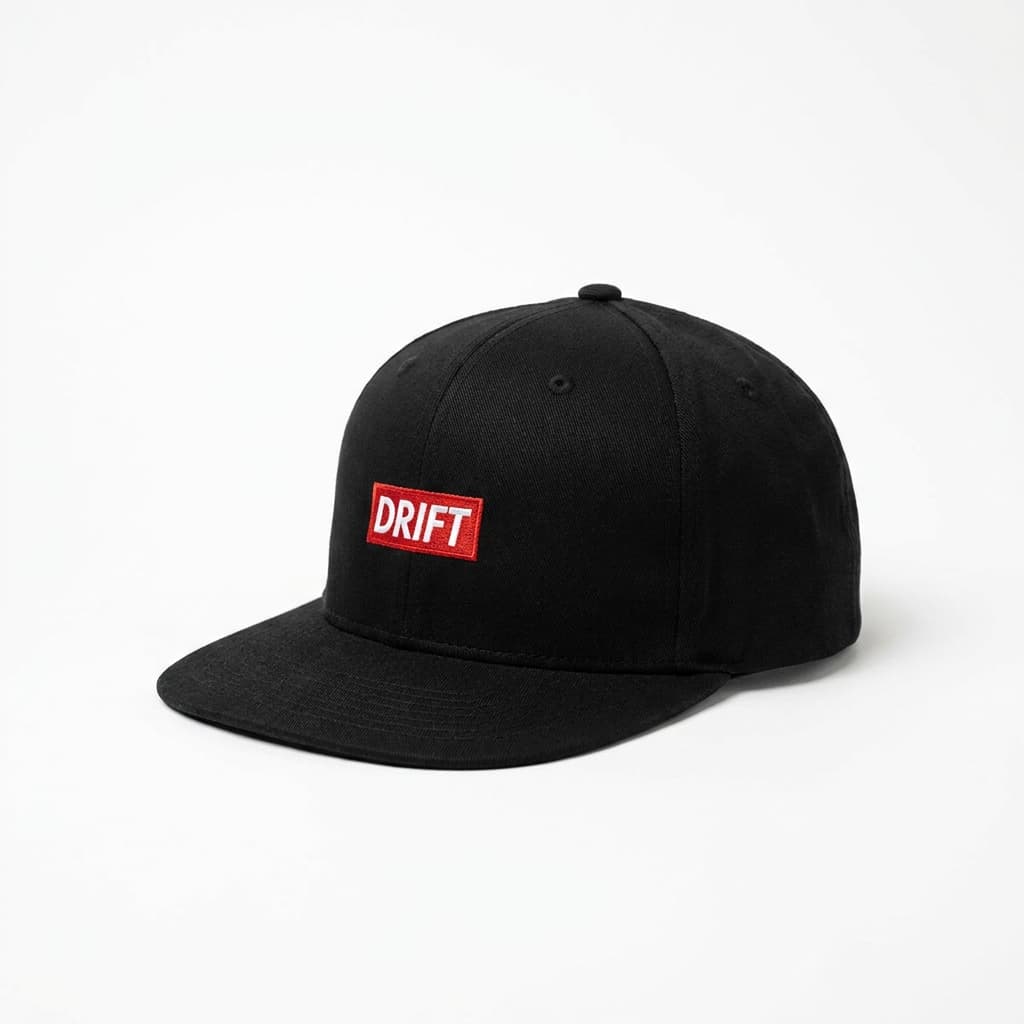 Drift wide brim black cap with red box logo, on stark white.