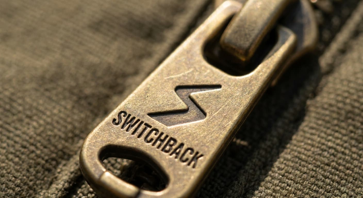 Switchback logo applied to: Metal zipper pull